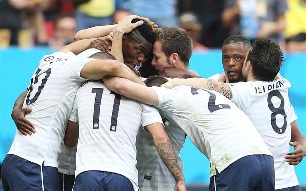 Paul Pogba celebrates with his team-mates after scoring the first goal